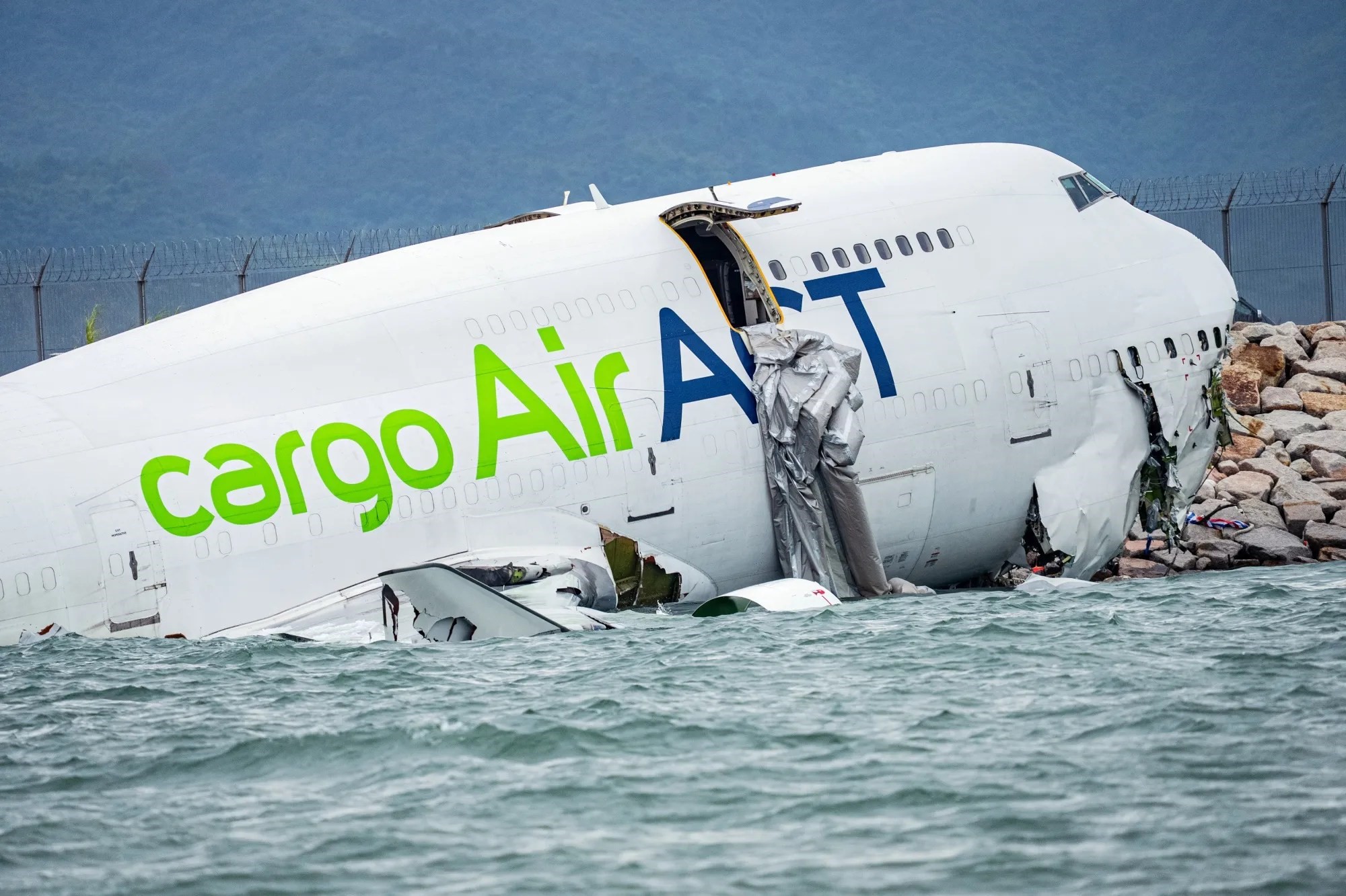 Two dead after cargo plane skids off Hong Kong runway into sea